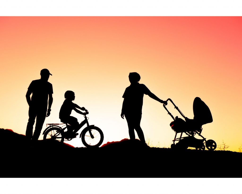 Family walk at sunset